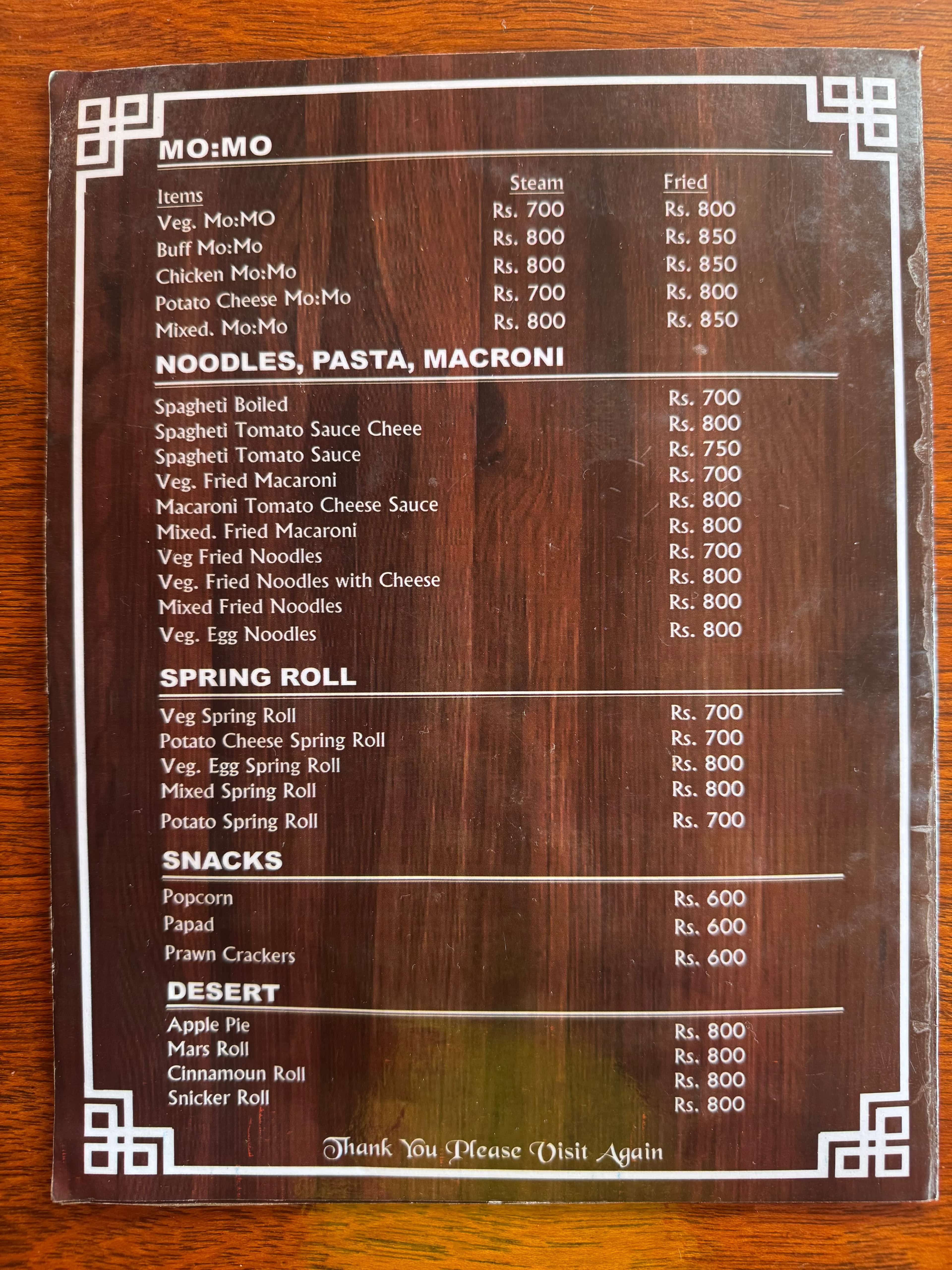 Menu page with momos, noodles, and snacks